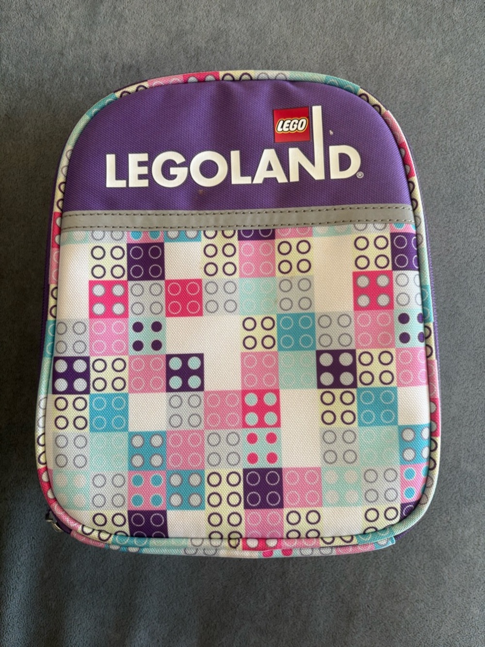 Lego Red and White Logo Tag on Gray Surface